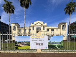 Banner featuring the first stage winners of LAGI 2025 Fiji and pointing the public to the exhibition at the Fiji Arts Council.