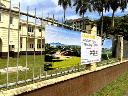 Banner featuring the first stage winners of LAGI 2025 Fiji and pointing the public to the exhibition at the Fiji Arts Council.