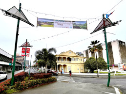Street banner featuring the first stage winners of LAGI 2025 Fiji and pointing the public to the exhibition at the Fiji Arts Council.