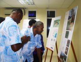 Marou Village residents inspect the details of the proposals in the exhibition at Fiji Arts Council.