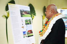 The Hon. Viliame Gavoka, Deputy Prime Minister of Fiji, reading project details at the LAGI 2025 Fiji exhibition opening at Fiji Arts Council.