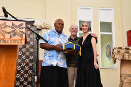 Elizabeth Monoian and Robert Ferry present a gift to Ilisari Naqau, the Acting Chief of Marou Village.