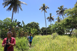 Young Kang and Alberto Roncelli walking the project site in Marou Village.