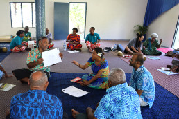 Seru Lasa explains the details of a project to a group of Marou residents.