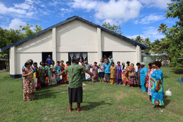 Marou Village forms a circle in front of the community center to represent The O by Alberto Roncelli.