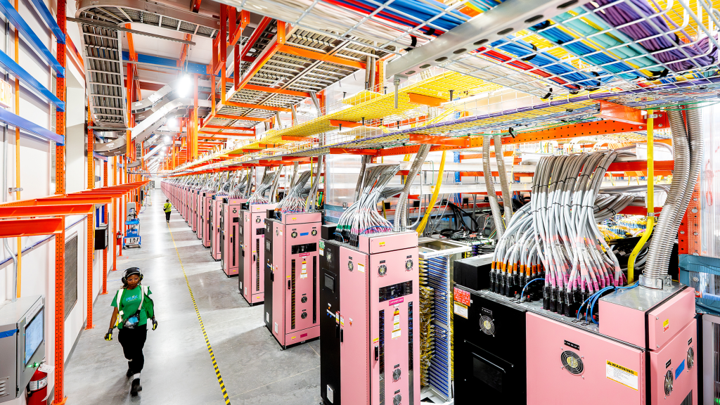 Inside Project Rainier, one of the world's largest AI compute clusters. Photo courtesy of <a href="https://www.aboutamazon.com/news/aws/aws-project-rainier-ai-trainium-chips-compute-cluster" target="blank">Amazon</a>.