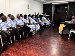 Alisi Ditri from the Ministry of Cooperatives explains the process of establishing an electric co-op to the leaders of Marou Village who were in Suva for the occasion of the LAGI 2025 Fiji exhibition opening.