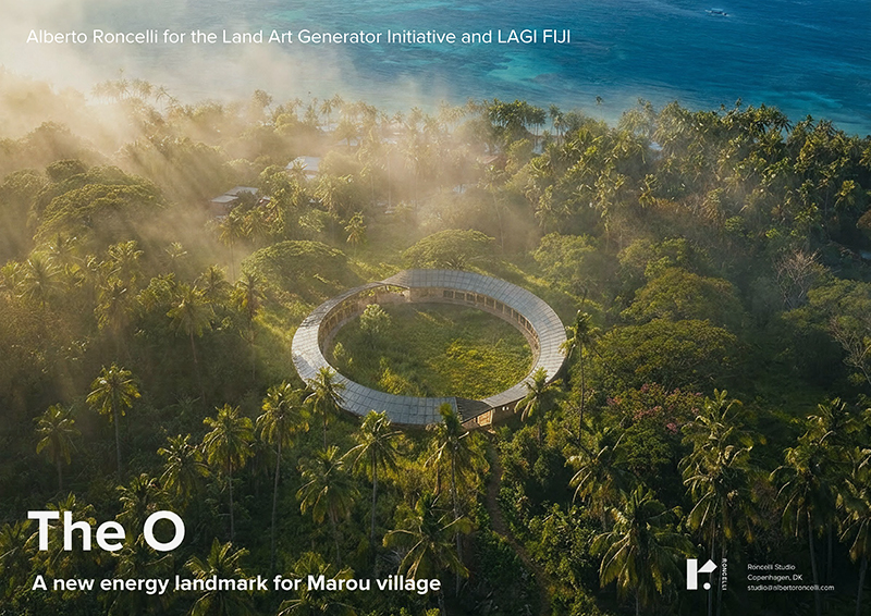 Light beams filter through the sky, illuminating a circular ring pavilion clad in solar modules. The setting is a remote Fijian island in the foothills next to a coastal village. Bright blue water fills the top of the frame.