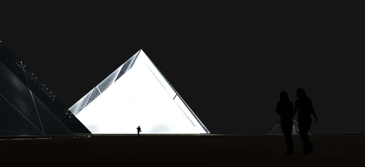 LAGI2010-lunarcubit4 A bright tilted cube shines at night with a human silhouette against it.