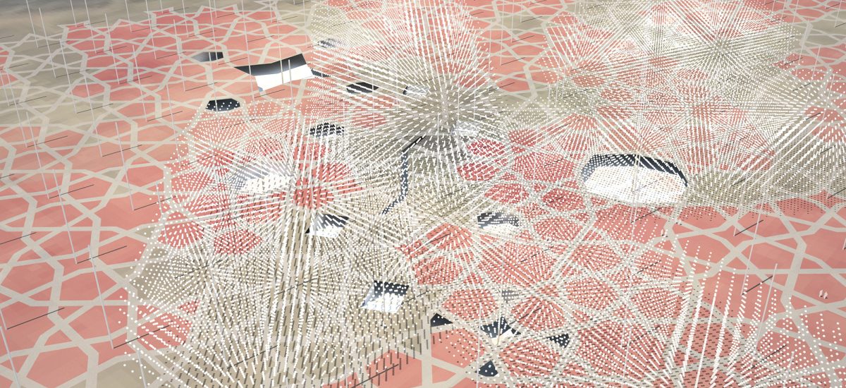 LAGI2010-pvdust_1 Aerial view of an Arabesque pattern with pink and white tiles and with white spheres in a 3-D grid suspended above.