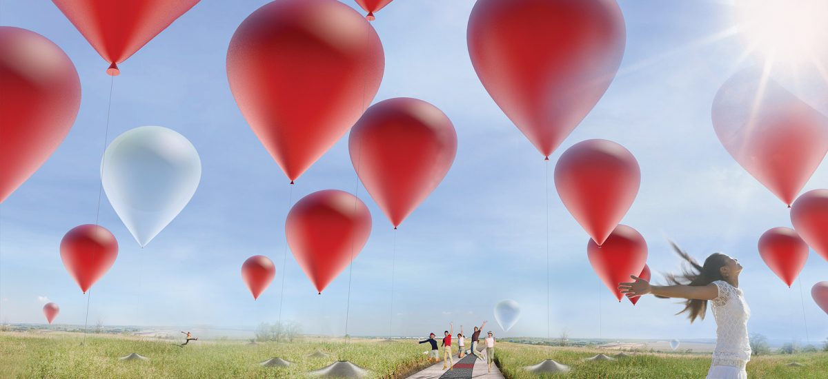 An array of large red balloons float above the park. In the foreground a girl looks up to the sky with her hands outstretched.