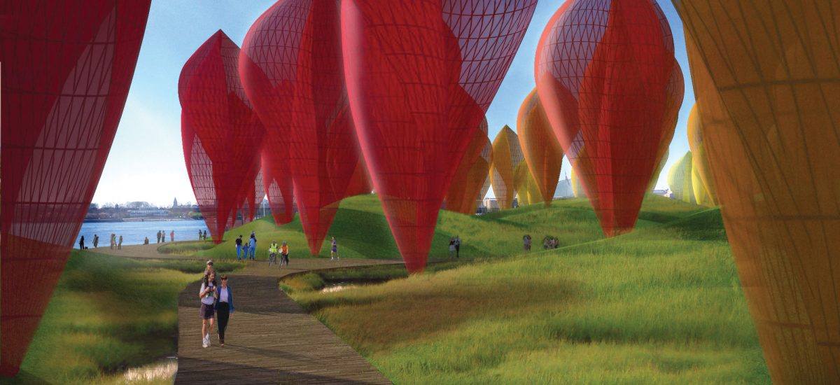 Red and yellow sculptural artworks in the landscape.