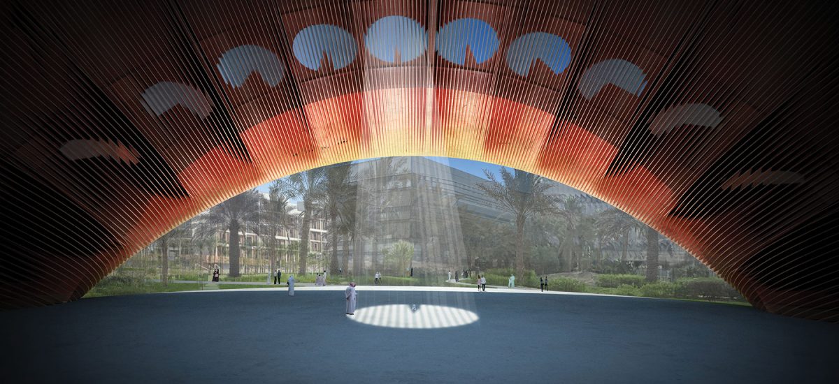 The design of the artwork is inspired by the sundial—the oldest known device used to measure time by the apparent position of the sun in the sky. In this case, the traditional configuration is reversed. Rather than a gnomon casting shadows, the time of the day is indicated by sunlight projected through a series of openings within a surface of photovoltaic modules capable of generating both solar power and shade.